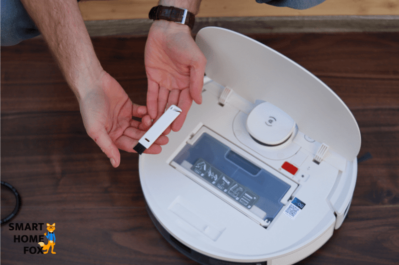 Holding up the cleaning tool of the Ecovacs Deebot N8